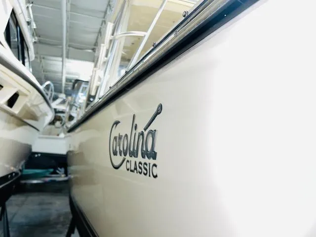 Slide: The Image of 2006 Carolina Classic 28 boat in storage, side view with logo. - 6
