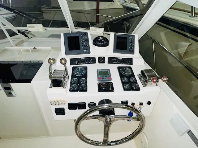 Slide: The Image of 2006 Carolina Classic 28 boat helm with dual displays and controls. - 7