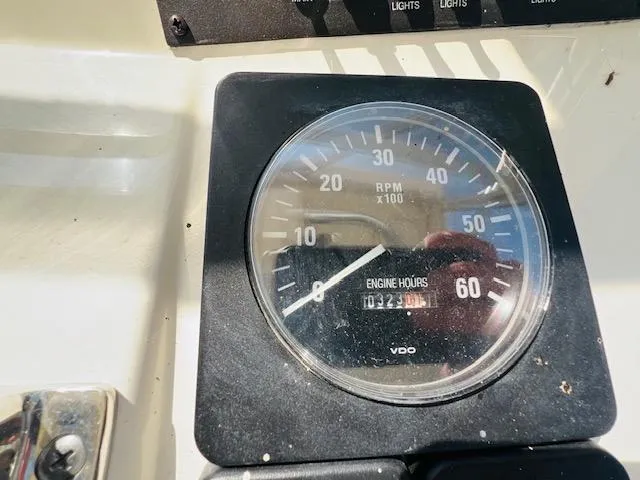 Slide: The Image of Close-up of a 2006 Carolina Classic 28 tachometer showing RPM and engine hours. - 9