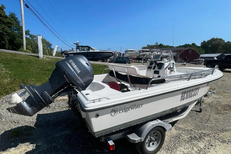 Slide: The Image of 2022 Edgewater 158CS boat with Yamaha outboard motor on a trailer. - 4