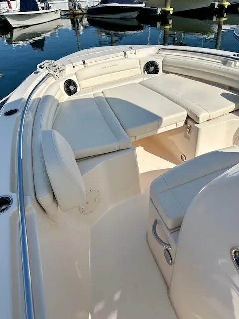 Slide: The Image of 2024 Grady-White Fisherman 216 boat interior with cushioned seating and storage. - 12