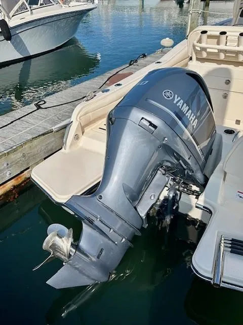 Slide: The Image of 2024 Grady-White Fisherman 216 with Yamaha outboard motor at dock. - 16