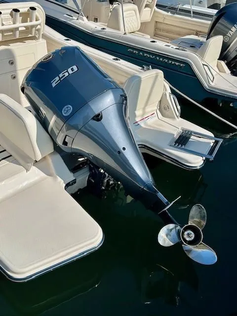 Slide: The Image of 2024 Grady-White Fisherman 216 boat with powerful 250 horsepower outboard motor. - 17