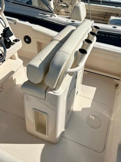 Slide: The Image of 2024 Grady-White Fisherman 216 boat interior with seating and rod holders. - 7