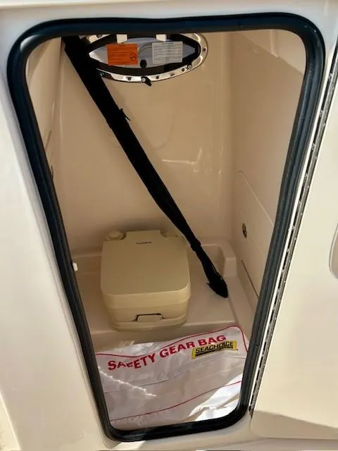 Slide: The Image of 2024 Grady-White Fisherman 216 boat storage with safety gear bag and portable toilet. - 9