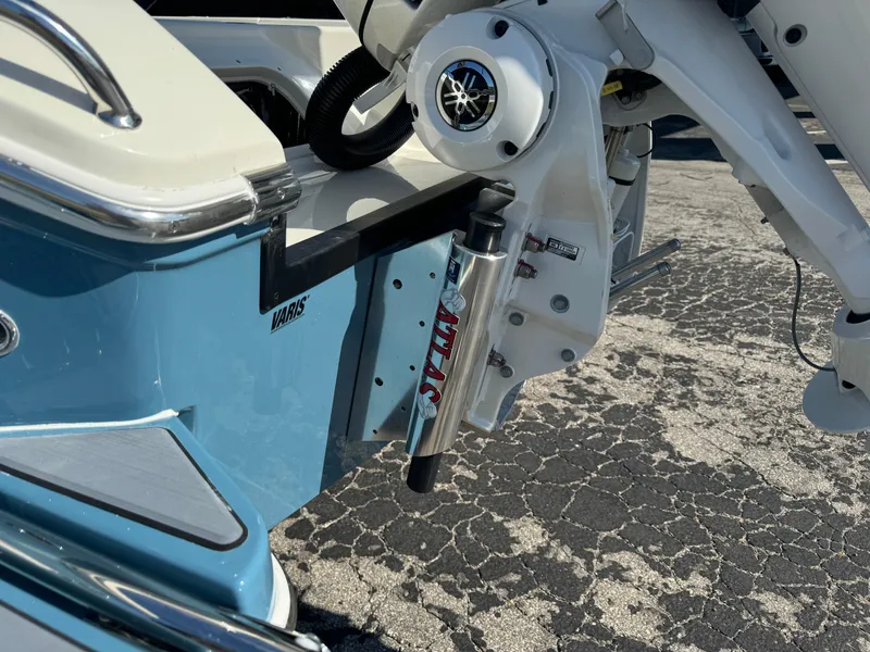 Slide: The Image of 2025 Pathfinder 2500 Hybrid boat with Yamaha engine, blue and white exterior. - 14