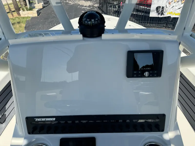 Slide: The Image of Pathfinder 2500 Hybrid 2025 boat dashboard with compass and electronic display. - 20