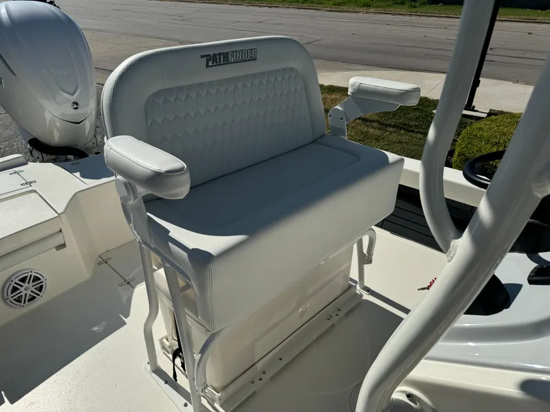 Slide: The Image of 2025 Pathfinder 2500 Hybrid boat seat with armrests and storage. - 27