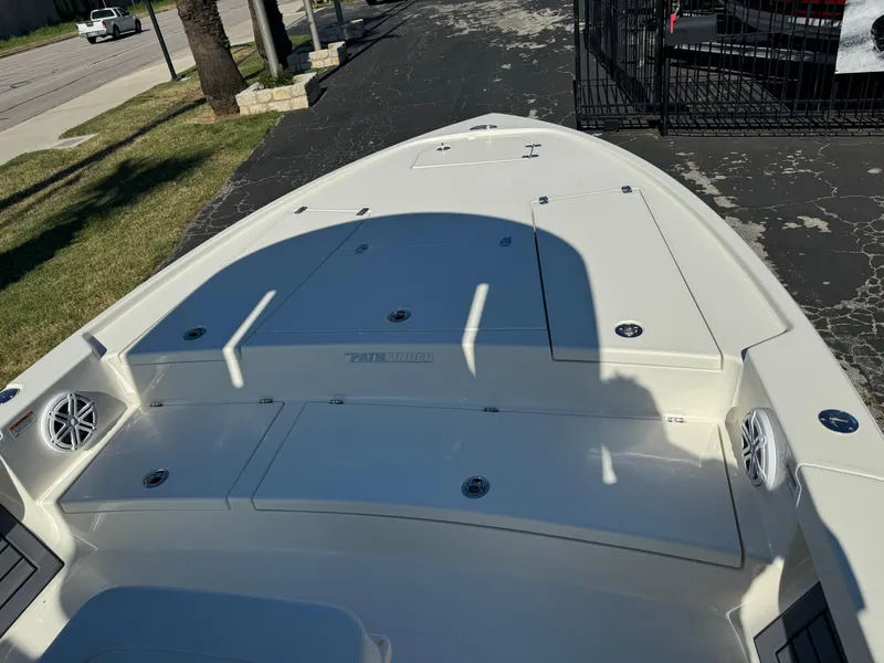 Slide: The Image of 2025 Pathfinder 2500 Hybrid boat deck with storage compartments and speakers. - 29