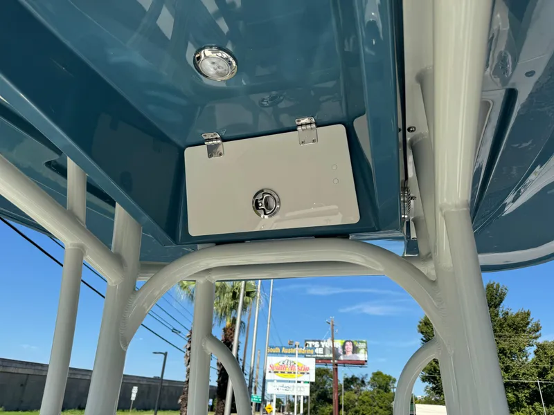 Slide: The Image of 2025 Pathfinder 2500 Hybrid boat T-top with storage compartment and lighting. - 31