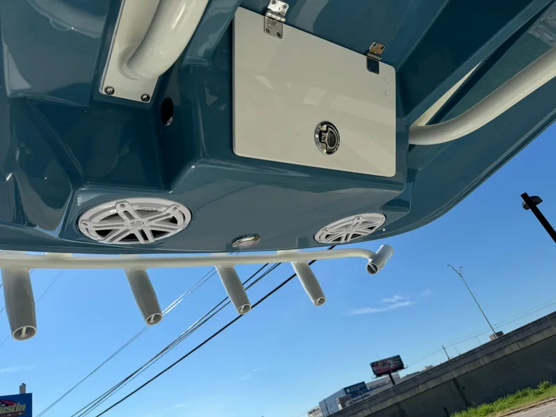 Slide: The Image of 2025 Pathfinder 2500 Hybrid boat underside with speakers and rod holders. - 32