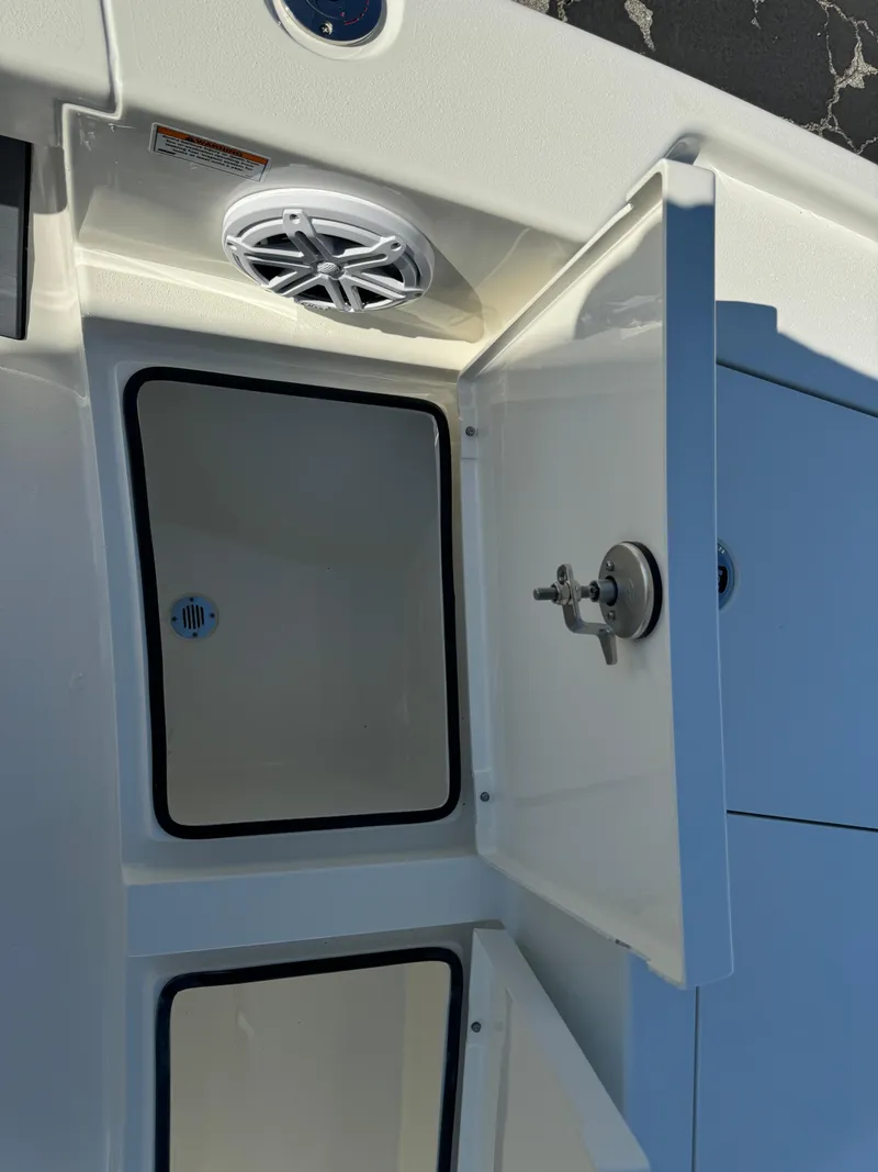 Slide: The Image of 2025 Pathfinder 2500 Hybrid boat storage compartments with open hatch. - 34