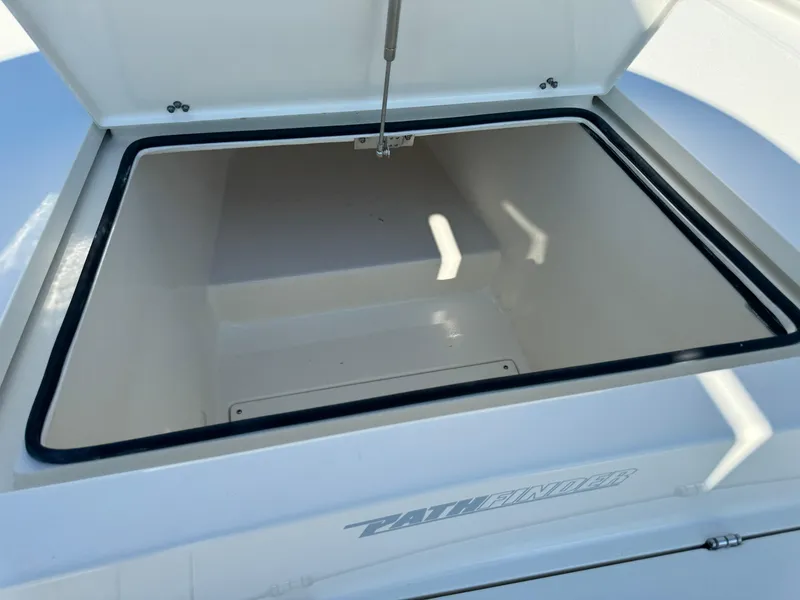 Slide: The Image of Open storage compartment on 2025 Pathfinder 2500 Hybrid boat. - 37