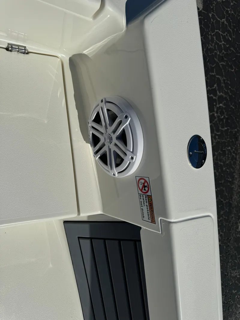 Slide: The Image of 2025 Pathfinder 2500 Hybrid boat interior with speaker and warning label. - 43