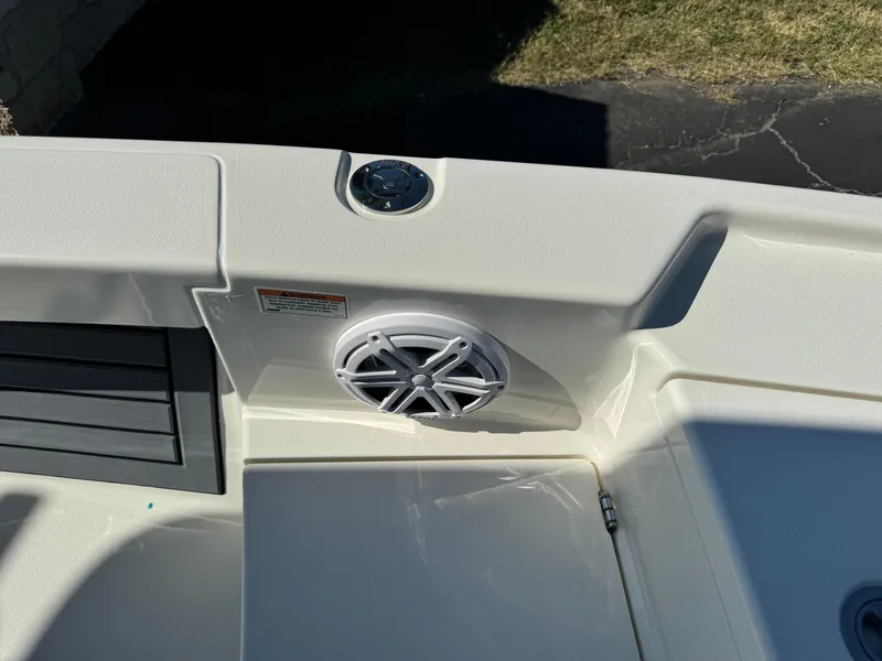 Slide: The Image of Pathfinder 2500 Hybrid 2025 boat interior with speaker and cup holder. - 44