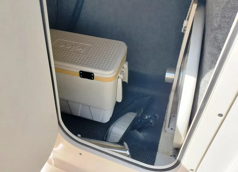 Slide: The Image of Interior storage of 2017 Chaparral Vortex 243 VRX with cooler and equipment. - 14