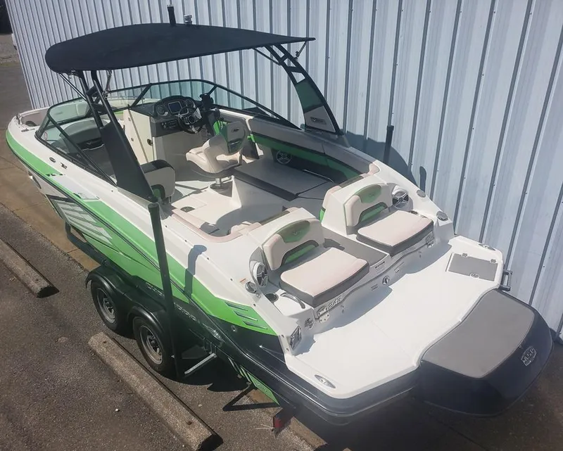 Slide: The Image of 2017 Chaparral Vortex 243 VRX boat with green accents and black canopy. - 2