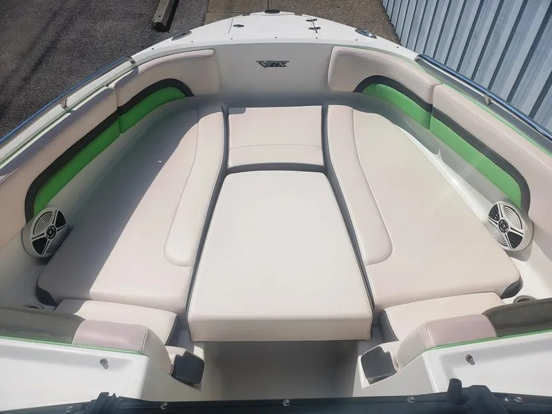 Slide: The Image of 2017 Chaparral Vortex 243 VRX boat interior with cushioned seating and speakers. - 6