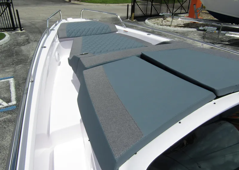 Slide: The Image of 2024 Axopar 37 Sun Top with spacious sunbathing area and sleek design. - 10