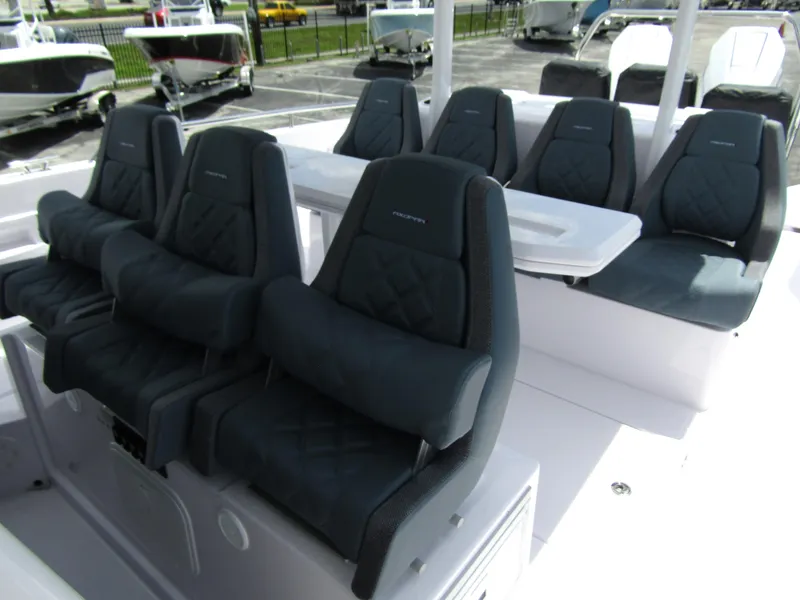 Slide: The Image of 2024 Axopar 37 Sun Top boat interior with luxurious seating arrangement. - 11
