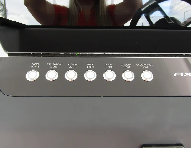 Slide: The Image of Control panel of 2024 Axopar 37 Sun Top with labeled light switches. - 14