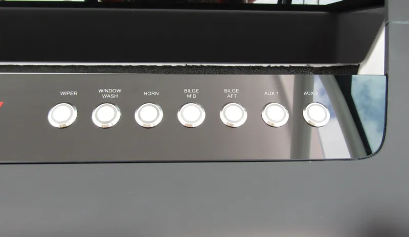 Slide: The Image of Control panel of 2024 Axopar 37 Sun Top with labeled buttons. - 15