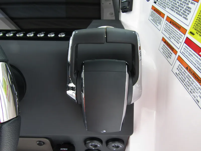 Slide: The Image of Throttle control of 2024 Axopar 37 Sun Top boat with warning labels. - 17