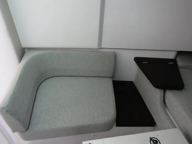 Slide: The Image of 2024 Axopar 37 Sun Top interior seating with modern gray upholstery. - 24