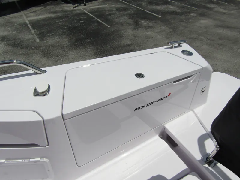 Slide: The Image of 2024 Axopar 37 Sun Top boat deck with storage compartment. - 28