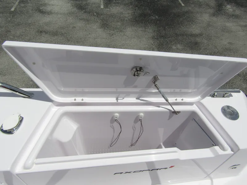 Slide: The Image of Open storage compartment on 2024 Axopar 37 Sun Top boat. - 29