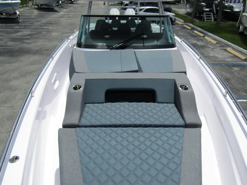 Slide: The Image of 2024 Axopar 37 Sun Top boat with sleek design and comfortable seating. - 9