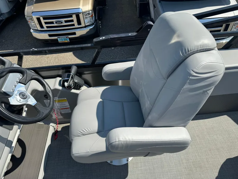 Slide: The Image of 2023 Regency 250 DL3 boat captain's chair and steering wheel. - 10
