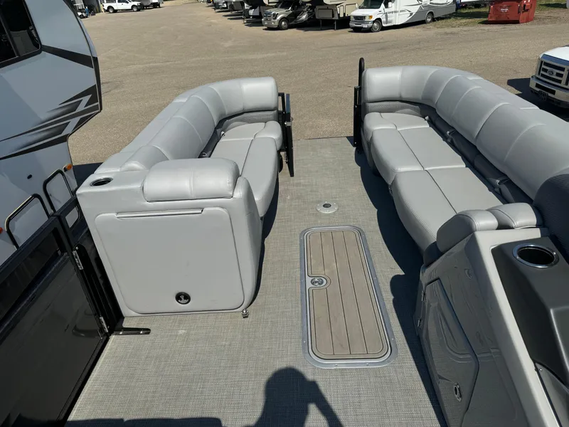 Slide: The Image of 2023 Regency 250 DL3 pontoon boat with spacious seating and modern design. - 12