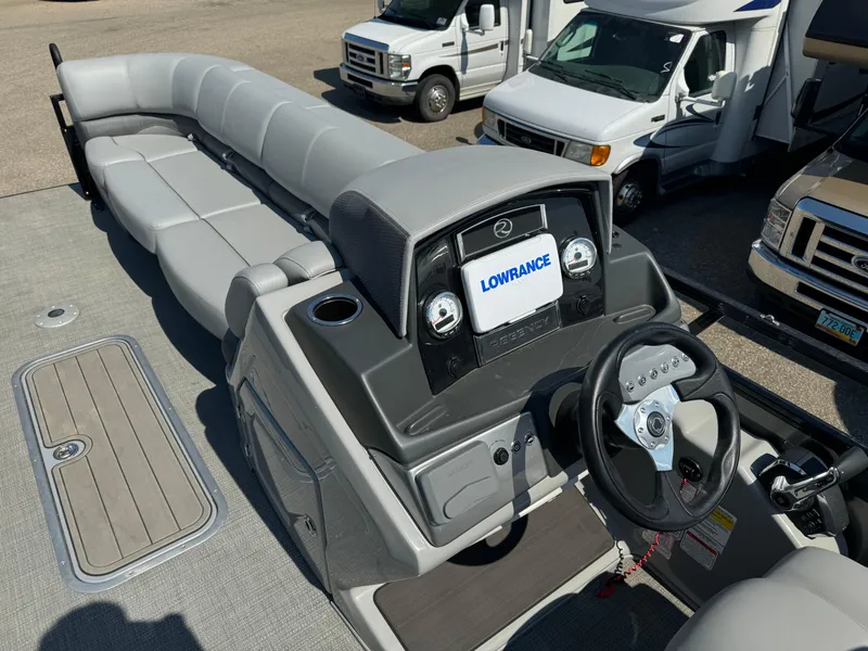 Slide: The Image of 2023 Regency 250 DL3 boat interior with steering console and seating. - 13