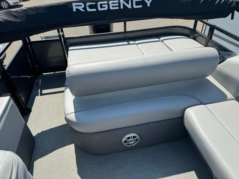 Slide: The Image of 2023 Regency 250 DL3 pontoon boat with comfortable seating and sleek design. - 18