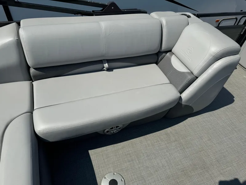 Slide: The Image of 2023 Regency 250 DL3 boat interior with gray cushioned seating. - 21