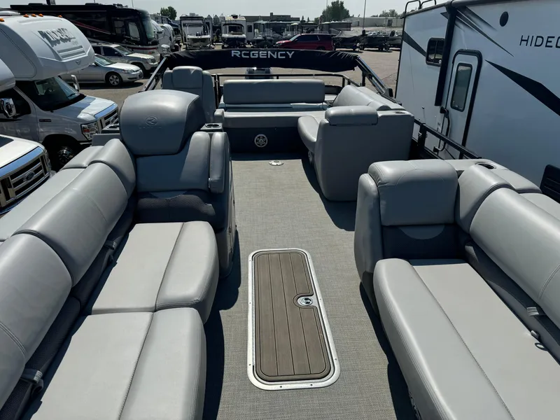 Slide: The Image of 2023 Regency 250 DL3 pontoon boat interior with spacious seating and modern design. - 25