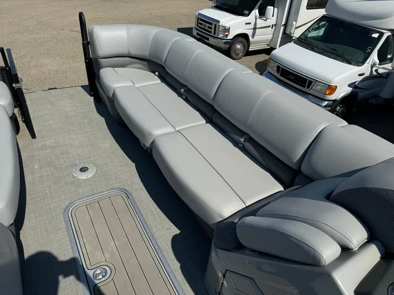 Slide: The Image of 2023 Regency 250 DL3 pontoon boat with spacious gray seating. - 7