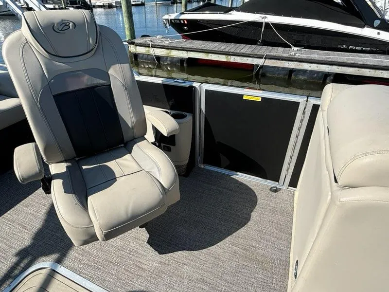 Slide: The Image of 2021 Barletta C24UC boat interior with plush seating and sleek design. - 7