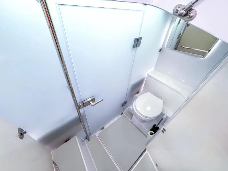 Slide: The Image of 2024 Axopar 37 Sun Top bathroom interior with modern fixtures and sleek design. - 17