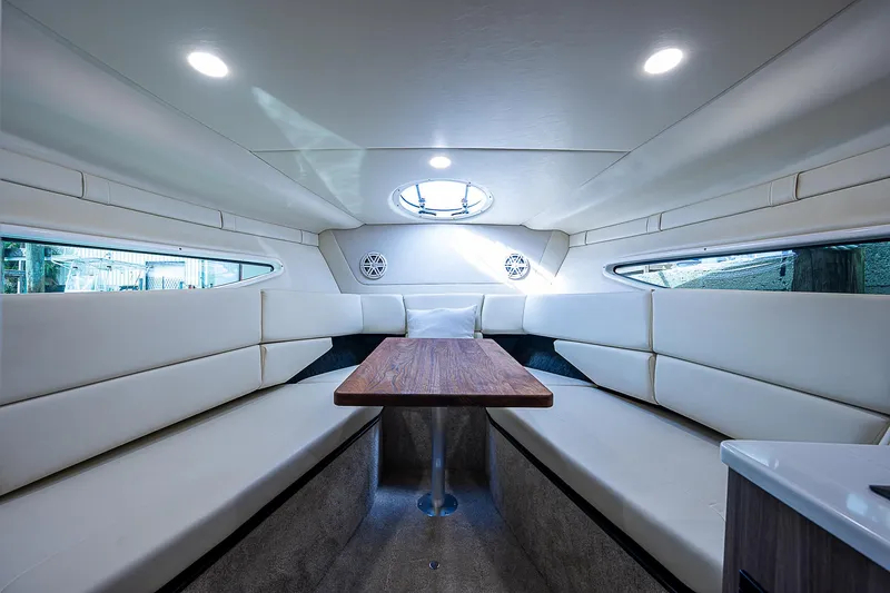 Slide: The Image of Luxurious interior of 2022 Regal 26 XO boat with elegant seating and table. - 10