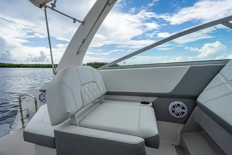 Slide: The Image of Interior of 2022 Regal 26 XO boat with luxurious seating and scenic water view. - 20