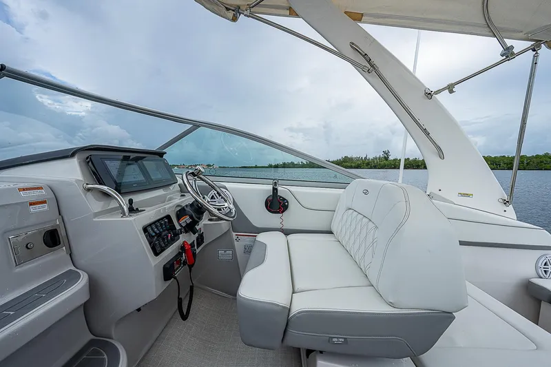 Slide: The Image of 2022 Regal 26 XO boat interior with modern helm and comfortable seating. - 21