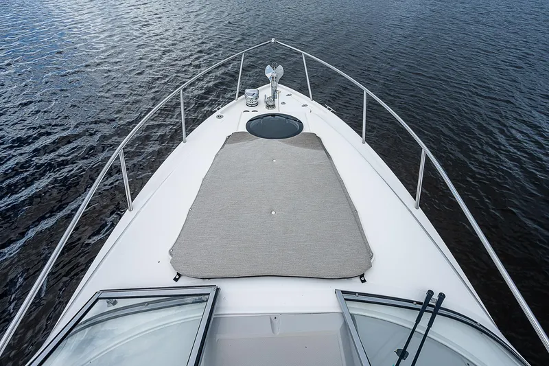 Slide: The Image of 2022 Regal 26 XO boat bow view on calm water. - 22