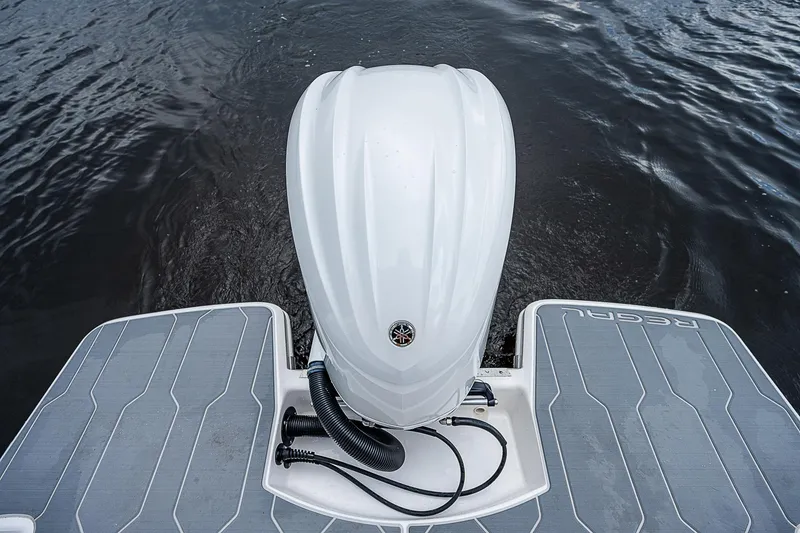 Slide: The Image of 2022 Regal 26 XO boat with Yamaha outboard motor on water. - 27