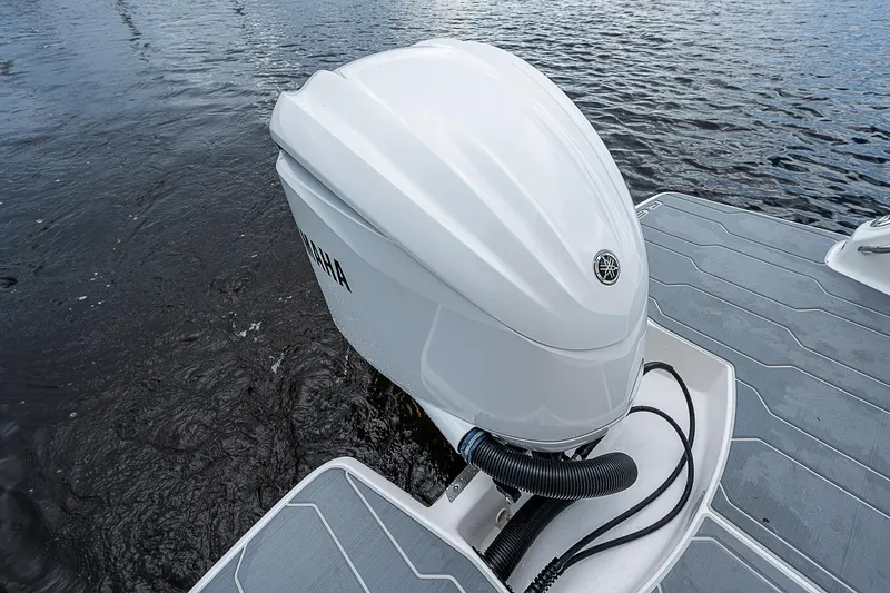 Slide: The Image of 2022 Regal 26 XO boat with Yamaha outboard engine on water. - 28