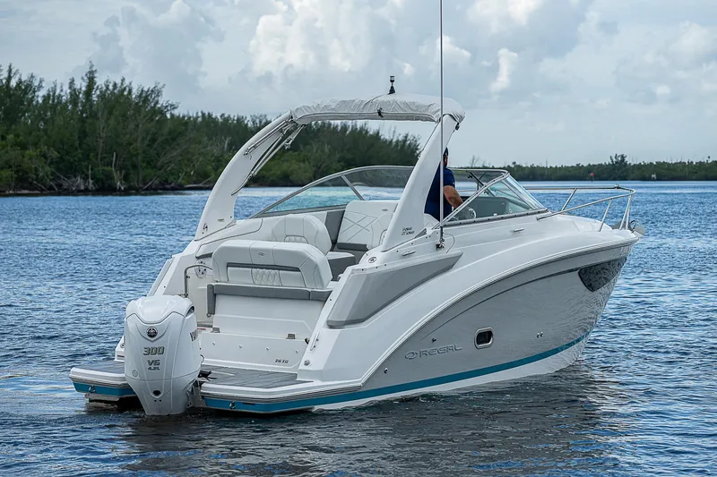Slide: The Image of 2022 Regal 26 XO boat on calm water, featuring sleek design and modern amenities. - 41