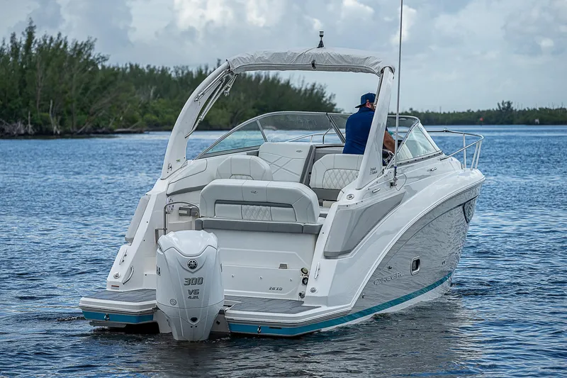 Slide: The Image of 2022 Regal 26 XO boat cruising on a calm lake. - 42