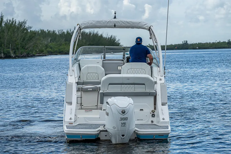 Slide: The Image of 2022 Regal 26 XO boat cruising on a calm lake. - 43