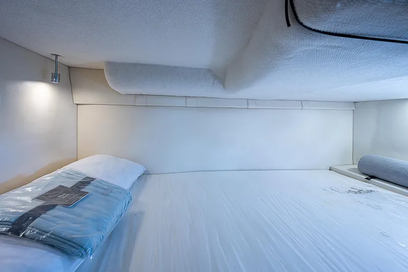 Slide: The Image of Interior cabin of 2022 Regal 26 XO boat, featuring a cozy sleeping area. - 5